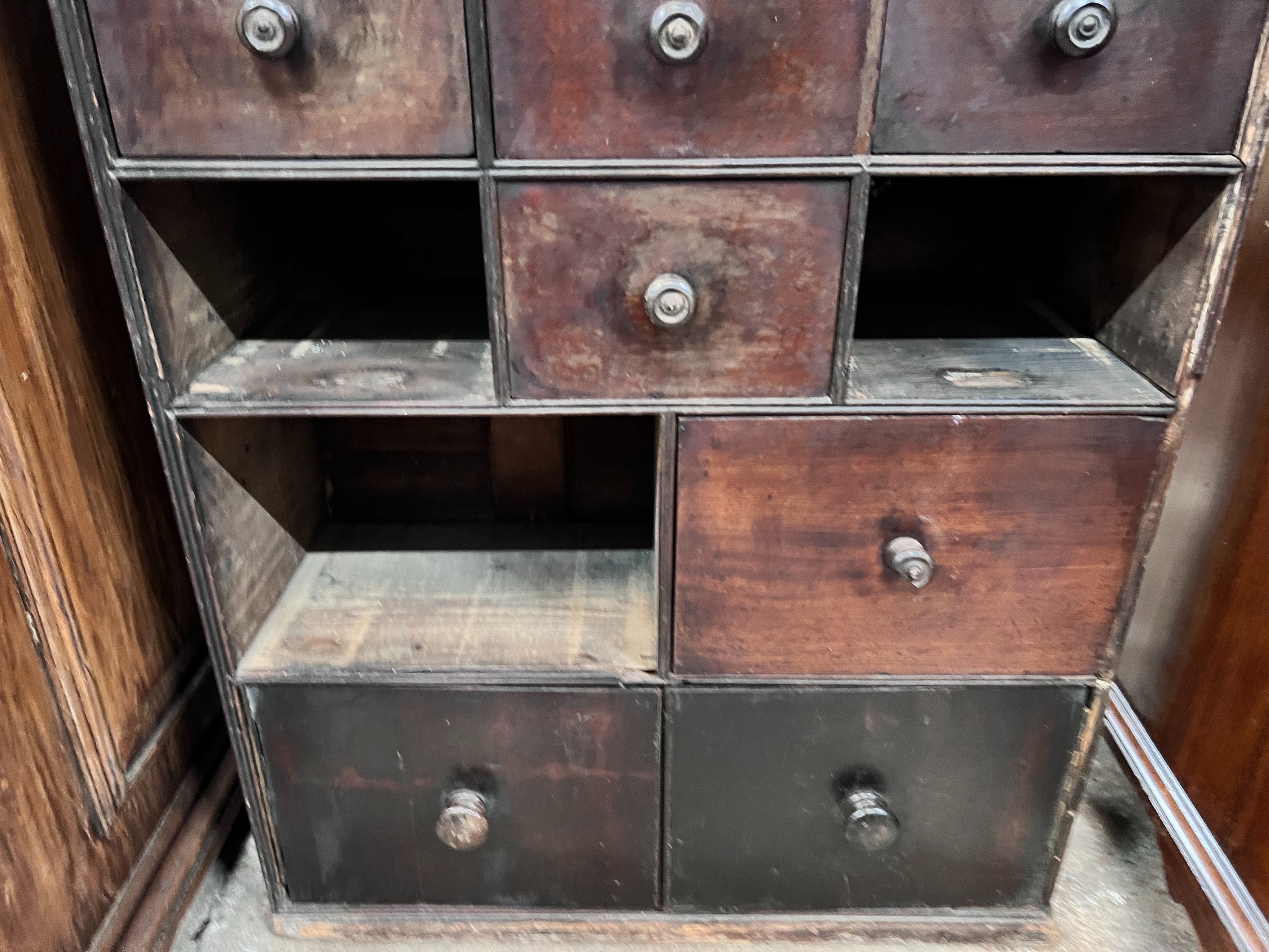 A collector's chest (missing three drawers), width 70cm, depth 28cm, height 116cm *Please note the sale commences at 9am.